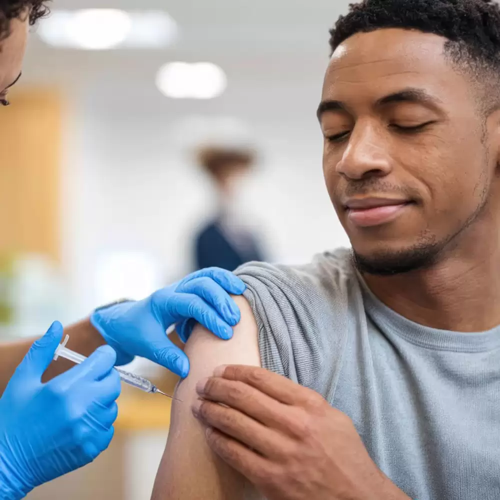 Occupational health specialist administering a vaccination