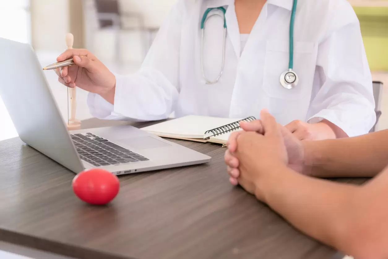 Occupation Health Technician consulting with a worker